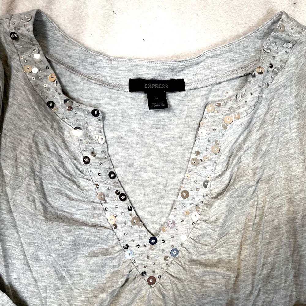 Grey soft knit V neck, with sequins & beading on v neck. Long sleeve. Size M.